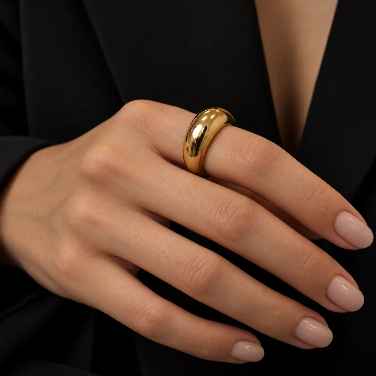Polished Gold Ring on Elegant Hand